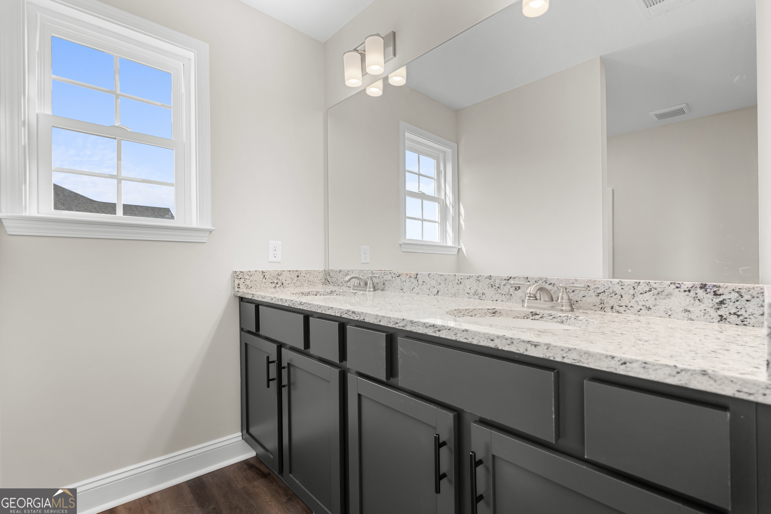 110 Enclave Court Statesboro, GA 30458 - Photo 8 of 16 a bathroom with a granite countertop sink and a window