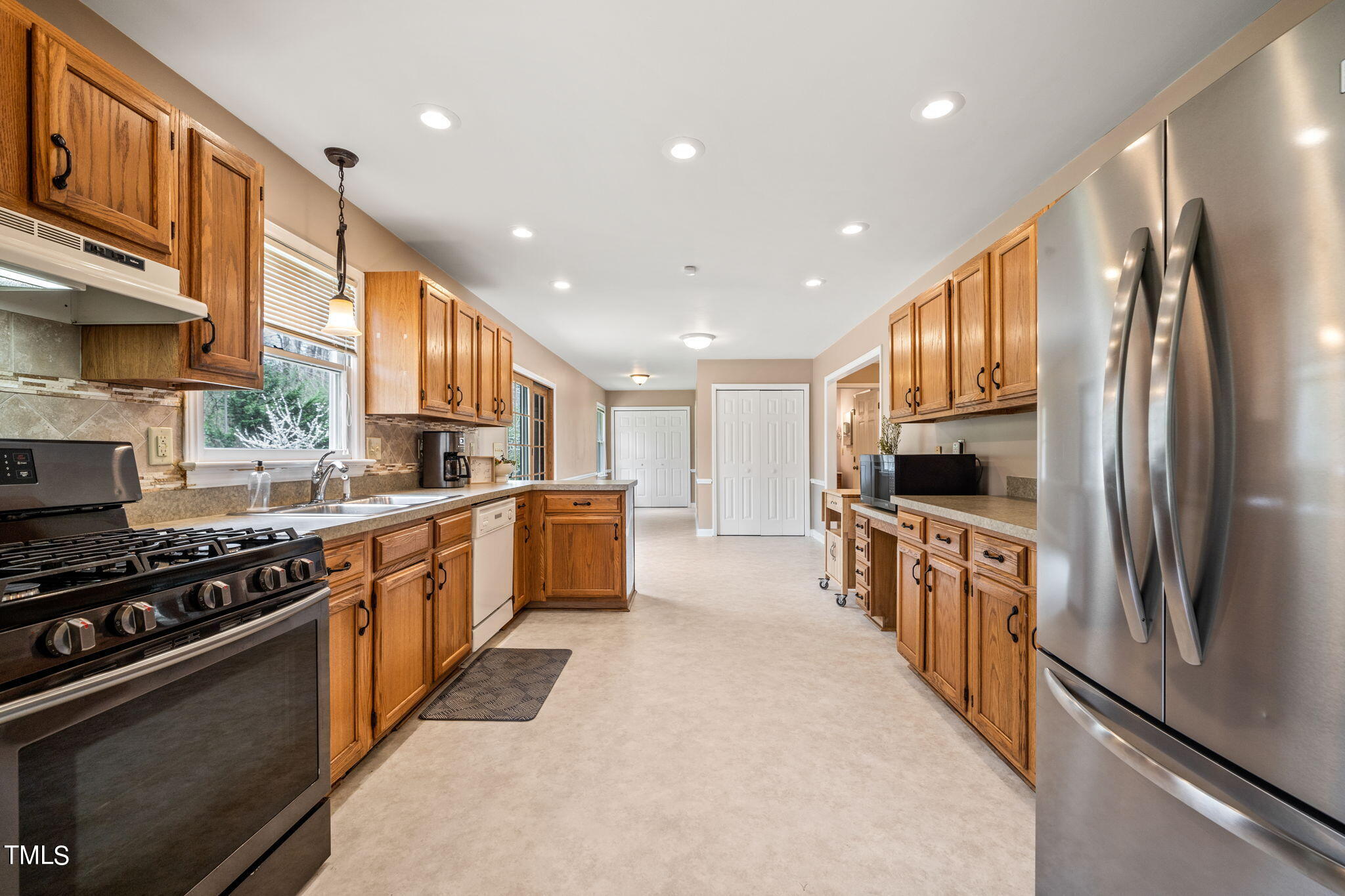 2415 Tryon Road Durham, NC 27705 - Photo 14 of 39 a large kitchen with stainless steel appliances