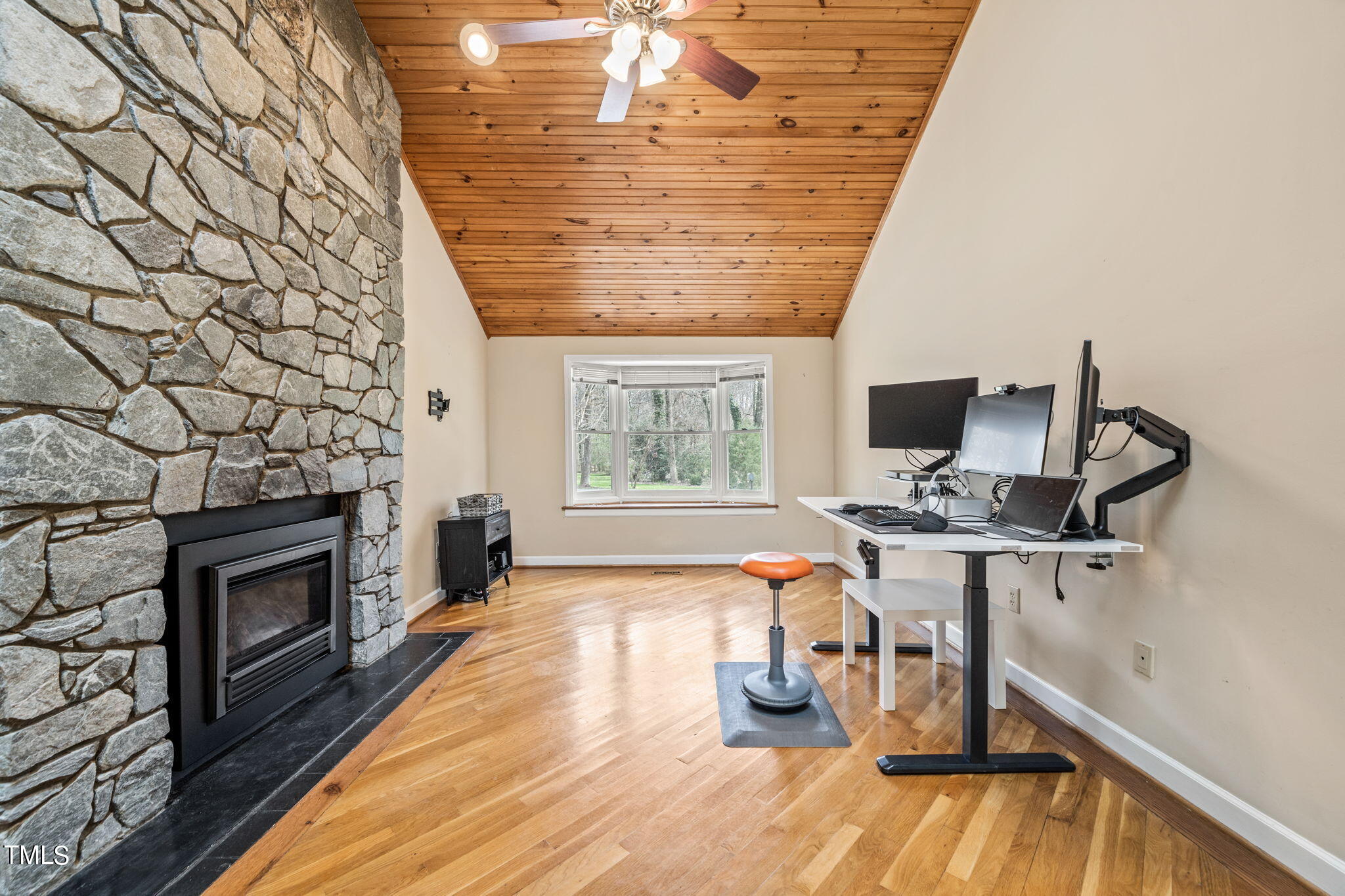 2415 Tryon Road Durham, NC 27705 - Photo 17 of 39 a view of a workspace with furniture and a fireplace