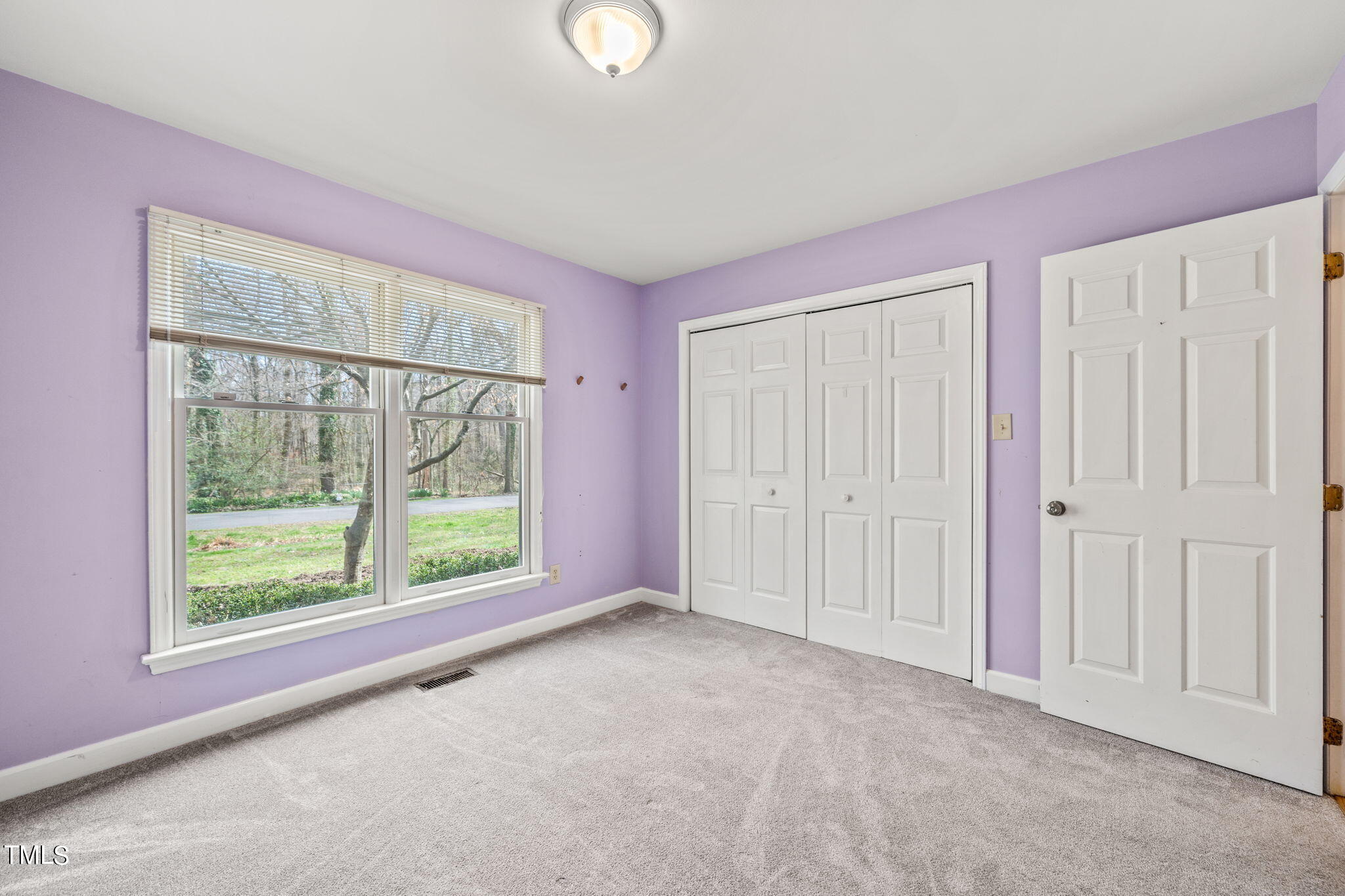 2415 Tryon Road Durham, NC 27705 - Photo 22 of 39 a view of an empty room with a window