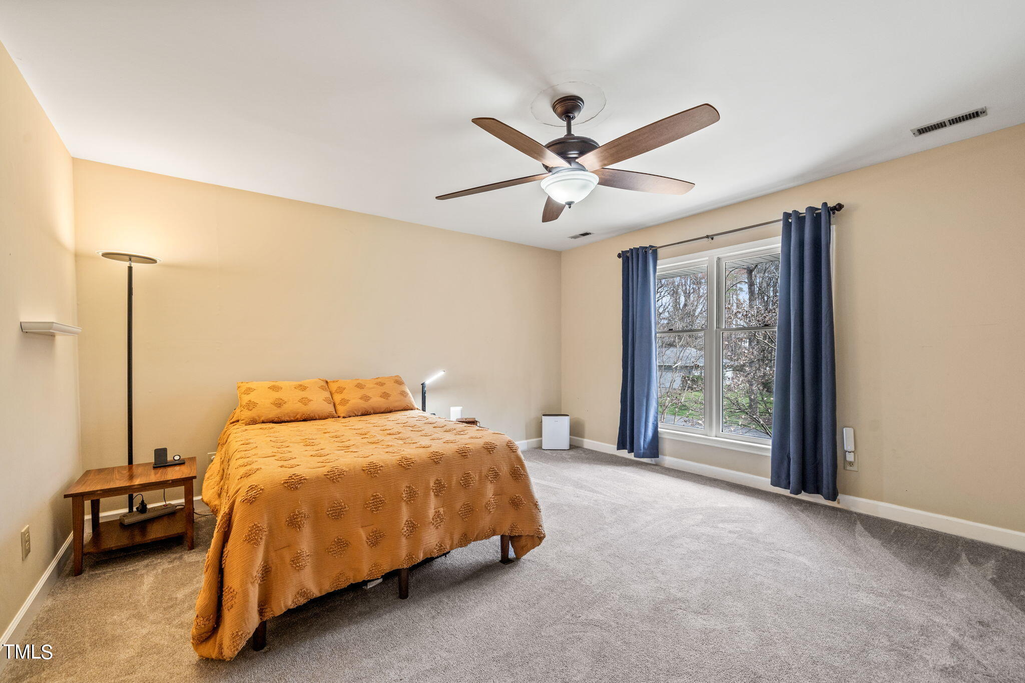 2415 Tryon Road Durham, NC 27705 - Photo 23 of 39 a bedroom with a bed and a window