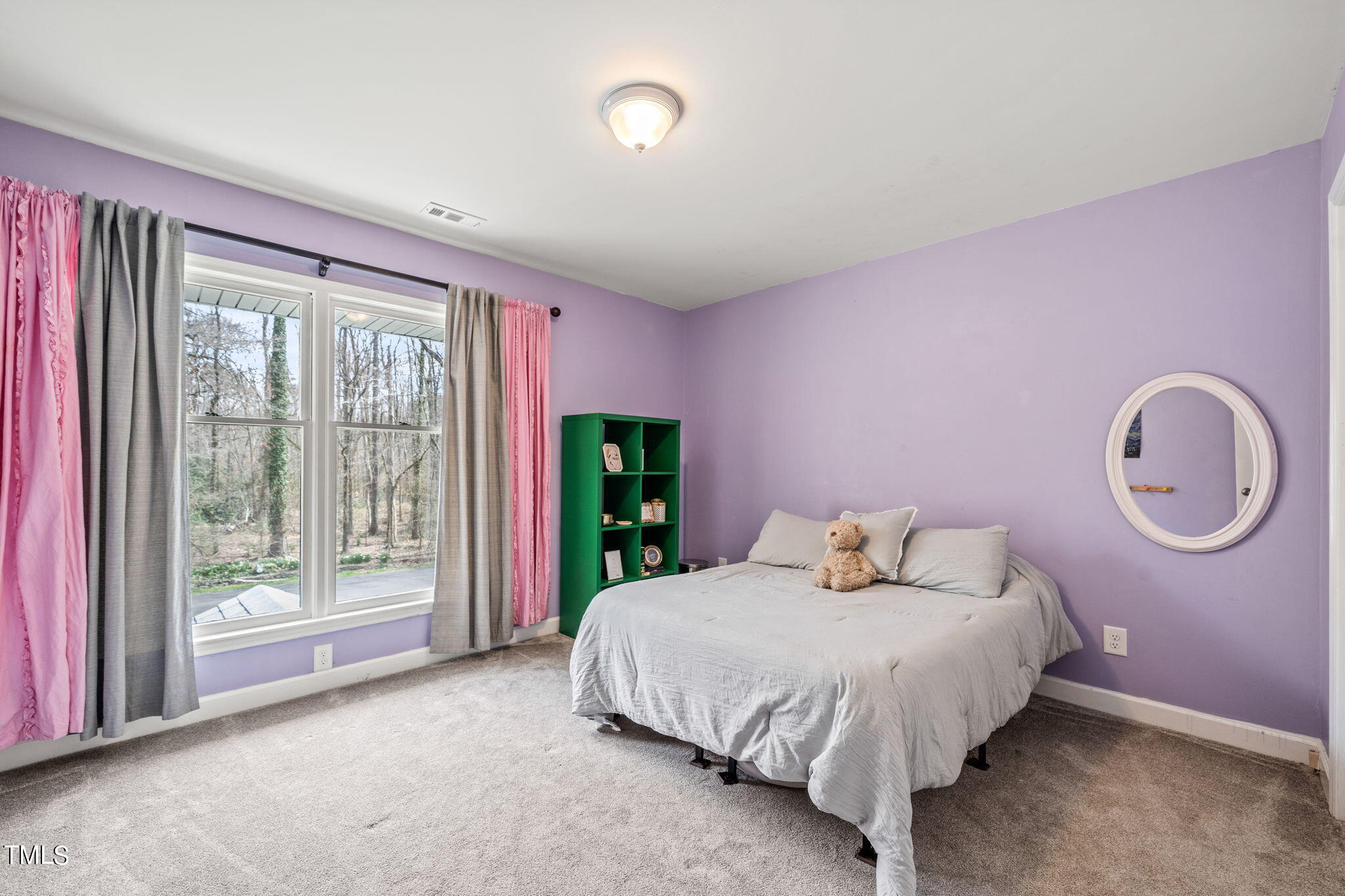 2415 Tryon Road Durham, NC 27705 - Photo 26 of 39 a bedroom with a bed and a large window