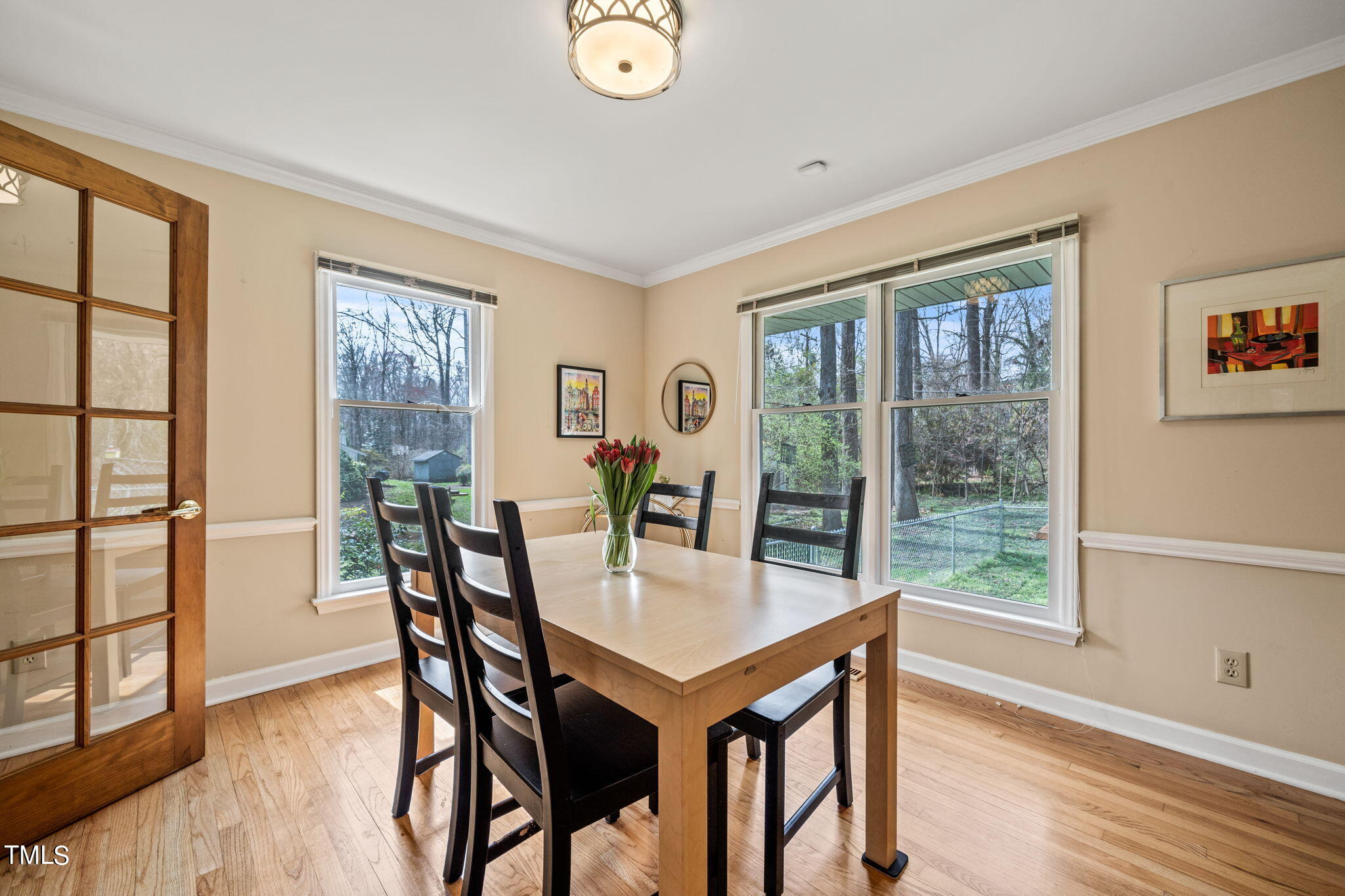 2415 Tryon Road Durham, NC 27705 - Photo 8 of 39 a view of a dining room with furniture window and wooden floor