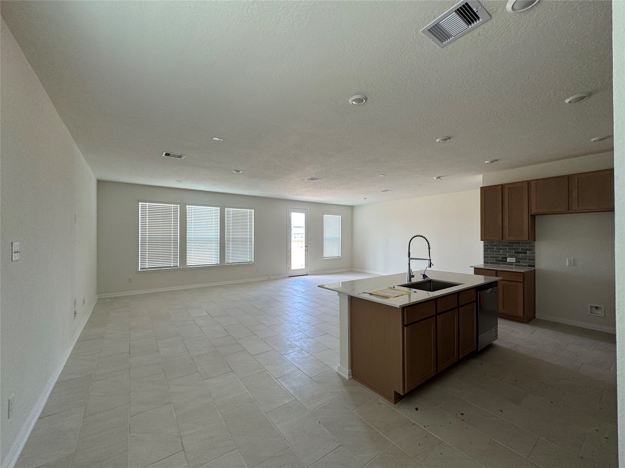 6415 Kentfield Drive Rosharon, TX 77583 - Photo 7 of 21 Open-concept kitchen designed for entertaining with seamless flow into the dining and living areas.