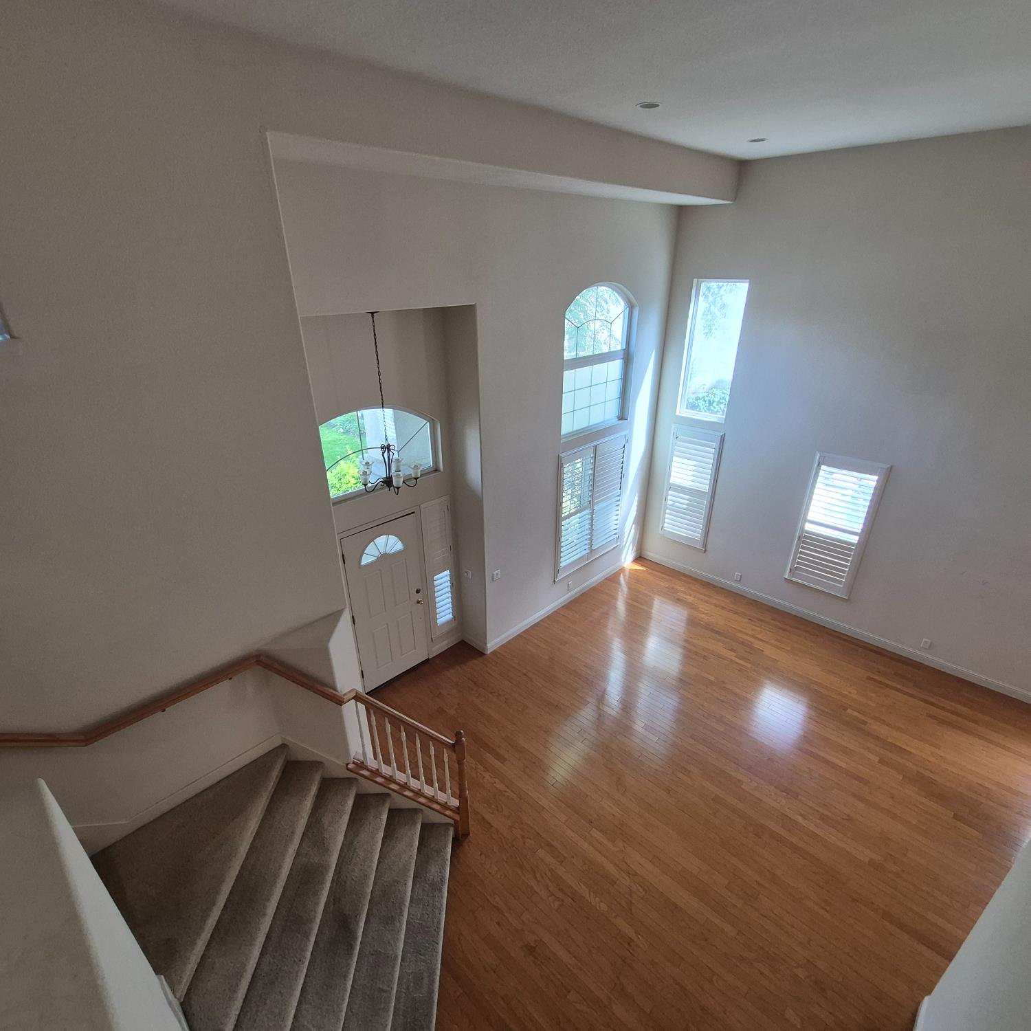 2604 Javan Lane Carmichael, CA 95608 - Photo 12 of 40 a view of an empty room with window and wooden floor