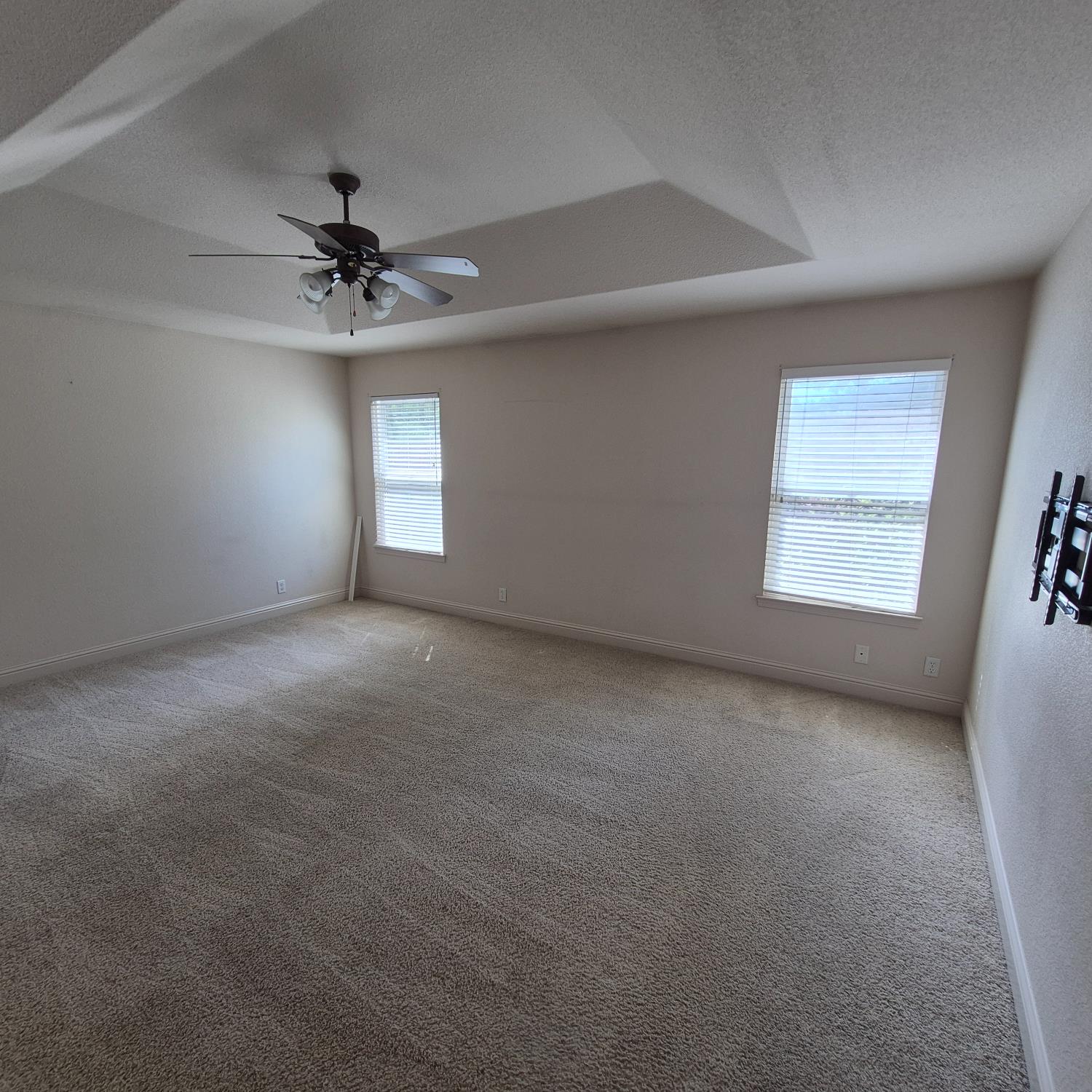2604 Javan Lane Carmichael, CA 95608 - Photo 13 of 40 a view of a big room with windows and ceiling fan