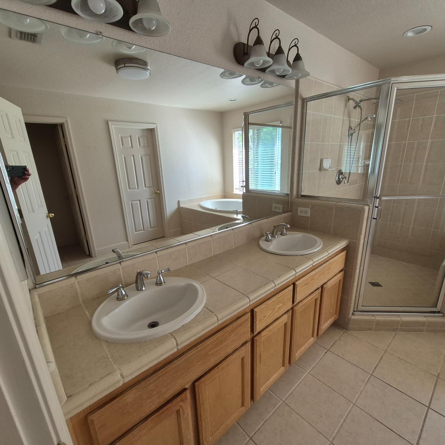 2604 Javan Lane Carmichael, CA 95608 - Photo 15 of 40 a bathroom with a sink and a mirror