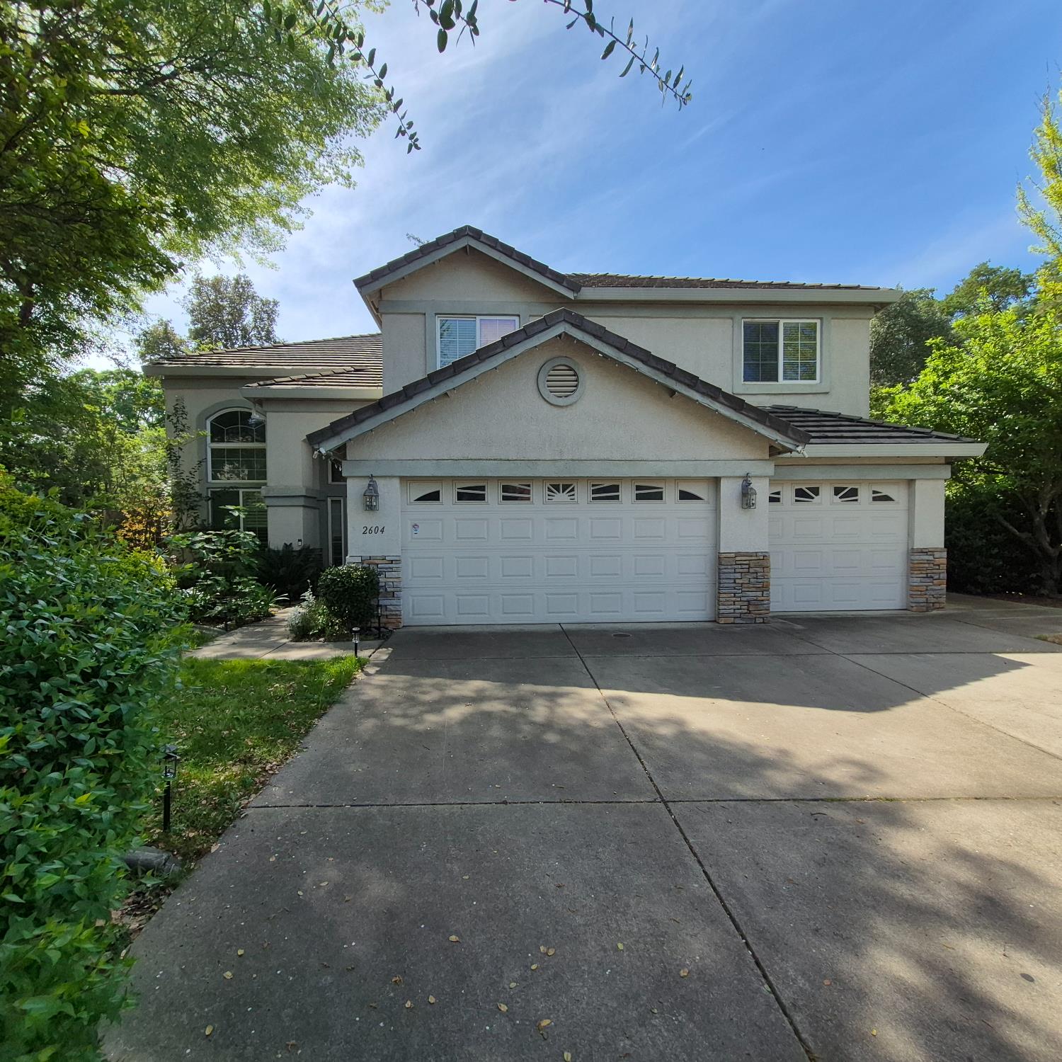 2604 Javan Lane Carmichael, CA 95608 - Photo 2 of 40 a front view of a house with a yard and garage