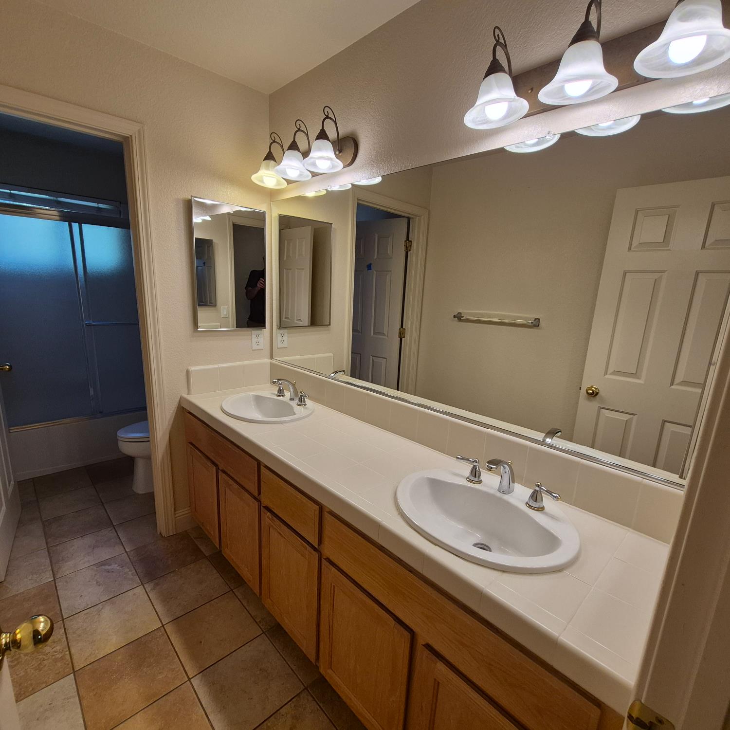 2604 Javan Lane Carmichael, CA 95608 - Photo 21 of 40 a bathroom with a sink double vanity and a mirror