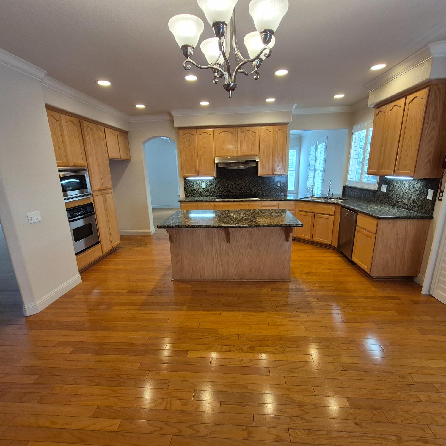 2604 Javan Lane Carmichael, CA 95608 - Photo 4 of 40 a view of kitchen with stainless steel appliances granite countertop a sink counter space and cabinets