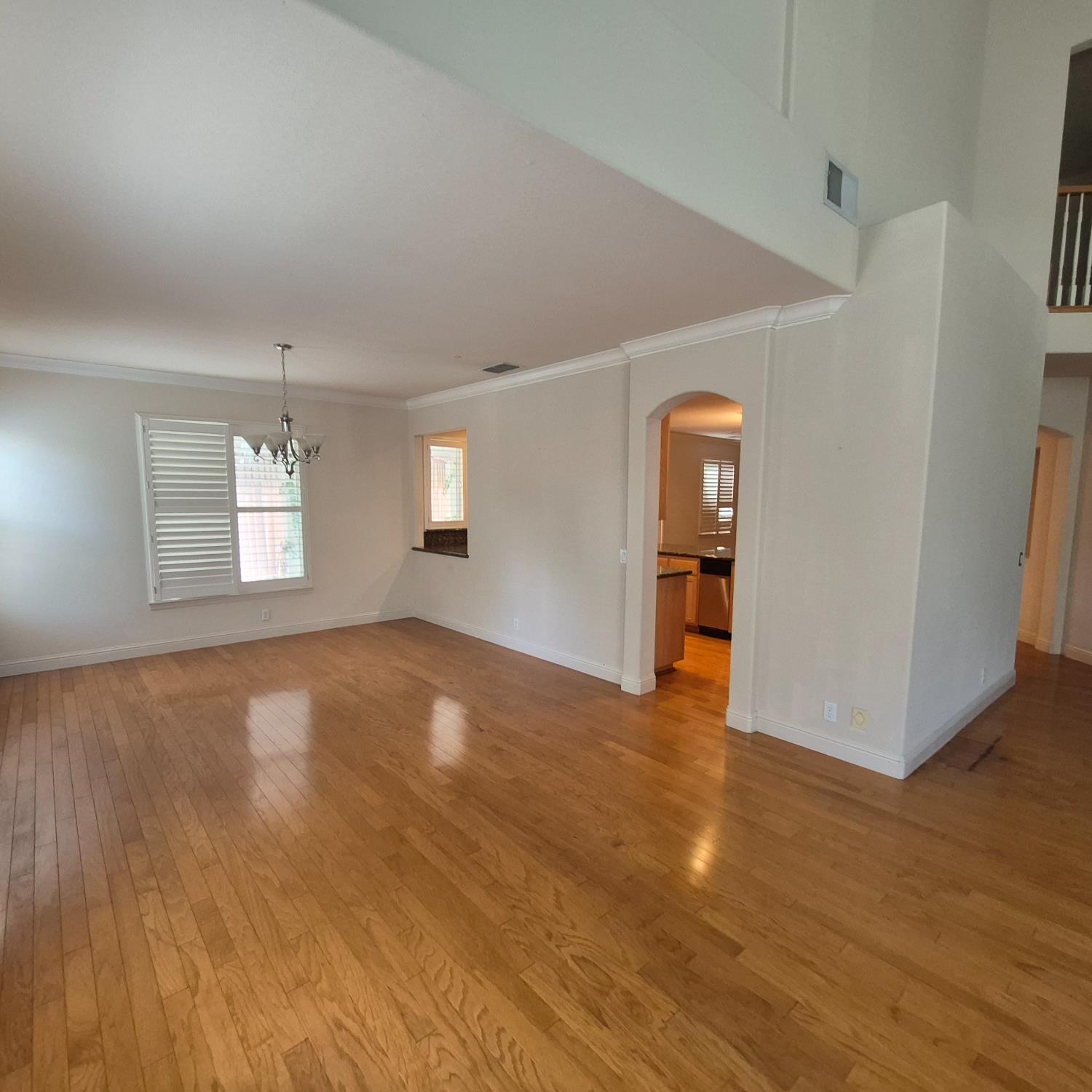 2604 Javan Lane Carmichael, CA 95608 - Photo 10 of 40 a view of empty room with wooden floor and fan