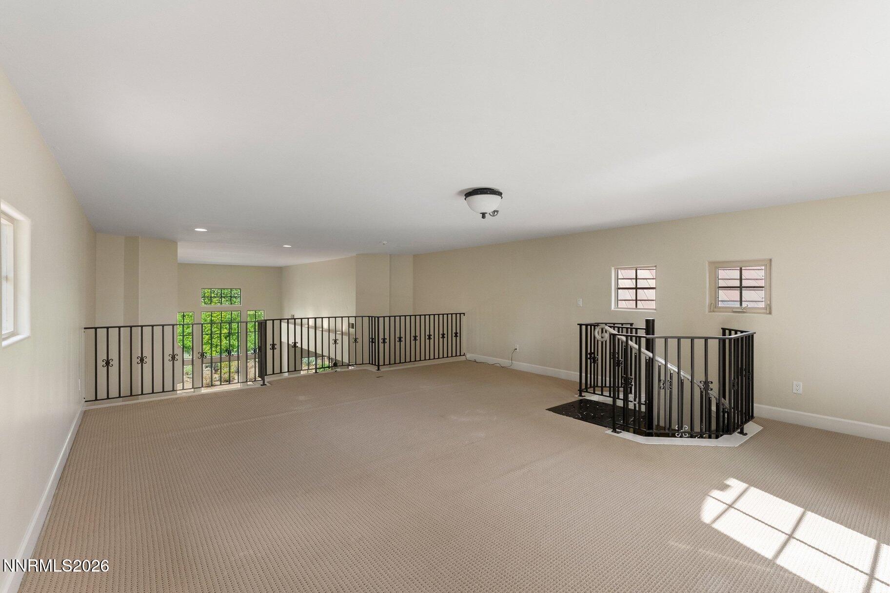 16925 Rue Du Parc Reno, NV 89511 - Photo 21 of 34 an empty room with furniture and windows