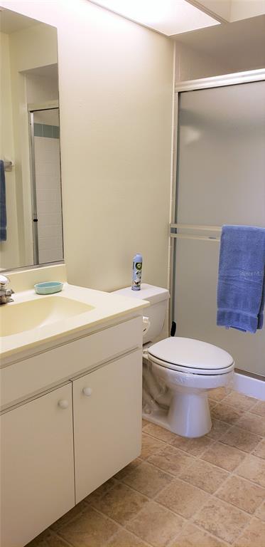 5678 Sheffield Greene Circle, Unit 76 Sarasota, FL 34235 - Photo 11 of 15 a bathroom with a toilet a sink and bathtub