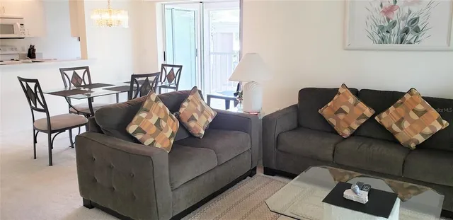 a living room with furniture and a couch