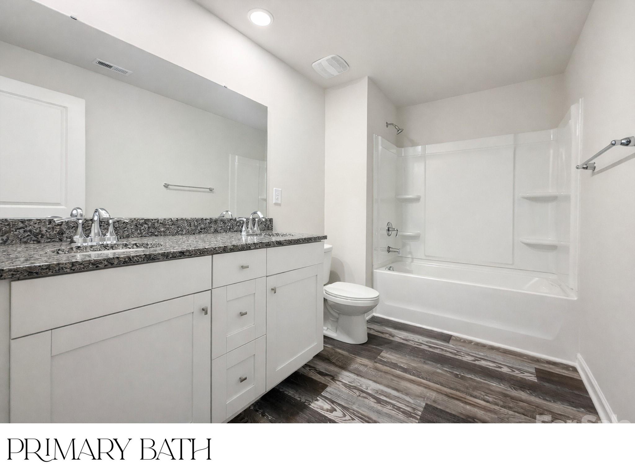 305 Firefly Path Shelby, NC 28150 - Photo 15 of 28 a bathroom with a sink a toilet a shower and a mirror