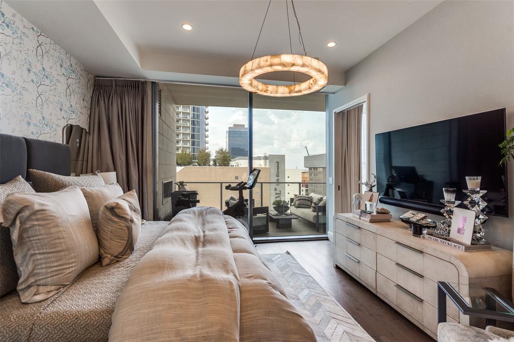 7901 Windrose Avenue, Unit 702 Plano, TX 75024 - Photo 18 of 40 a living room with furniture and a flat screen tv