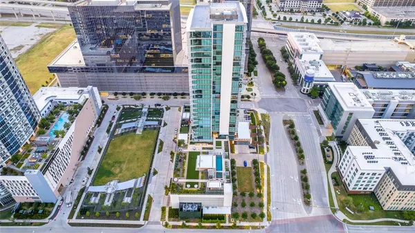 a aerial view of multi story residential apartment building with outdoor space