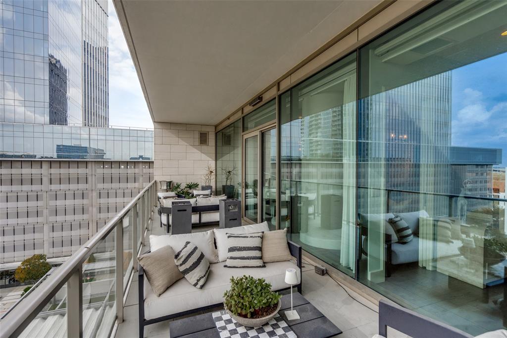 7901 Windrose Avenue, Unit 702 Plano, TX 75024 - Photo 27 of 40 a balcony with chairs and a potted plant