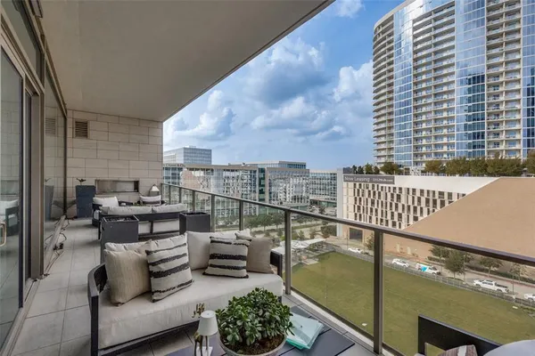 a terrace with outdoor seating and city view