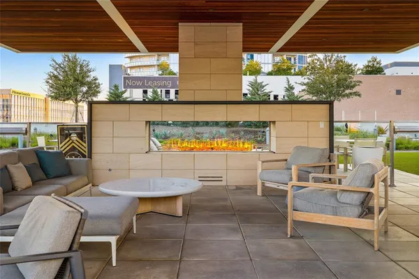 a outdoor space with a couch and chairs