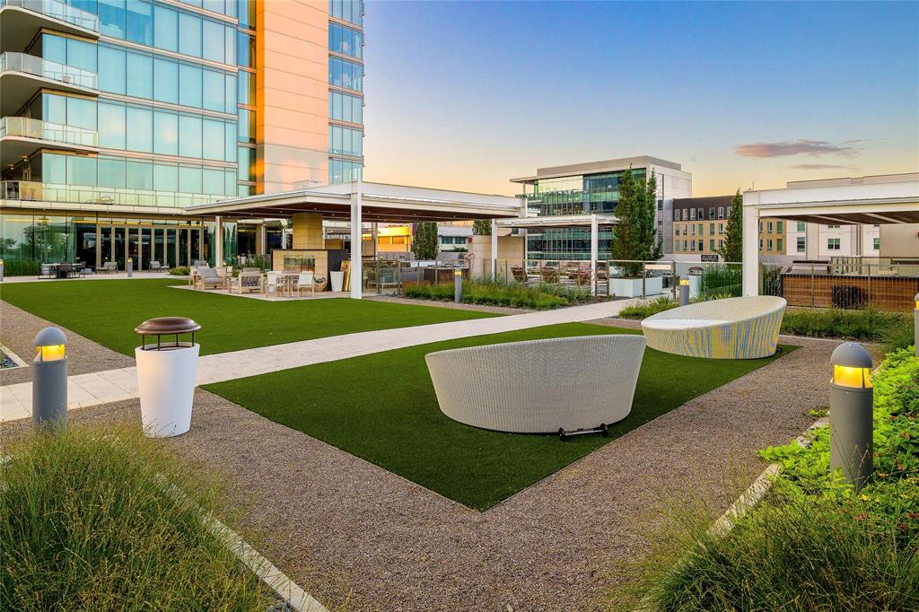 7901 Windrose Avenue, Unit 702 Plano, TX 75024 - Photo 35 of 40 a front view of a house with swimming pool having outdoor seating