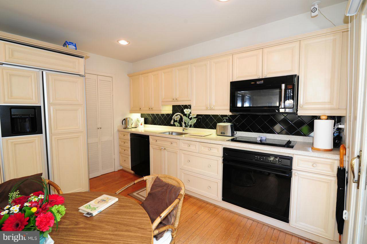 2012 Lakewinds Drive Reston, VA 20191 - Photo 12 of 26 a kitchen with a sink stove and microwave