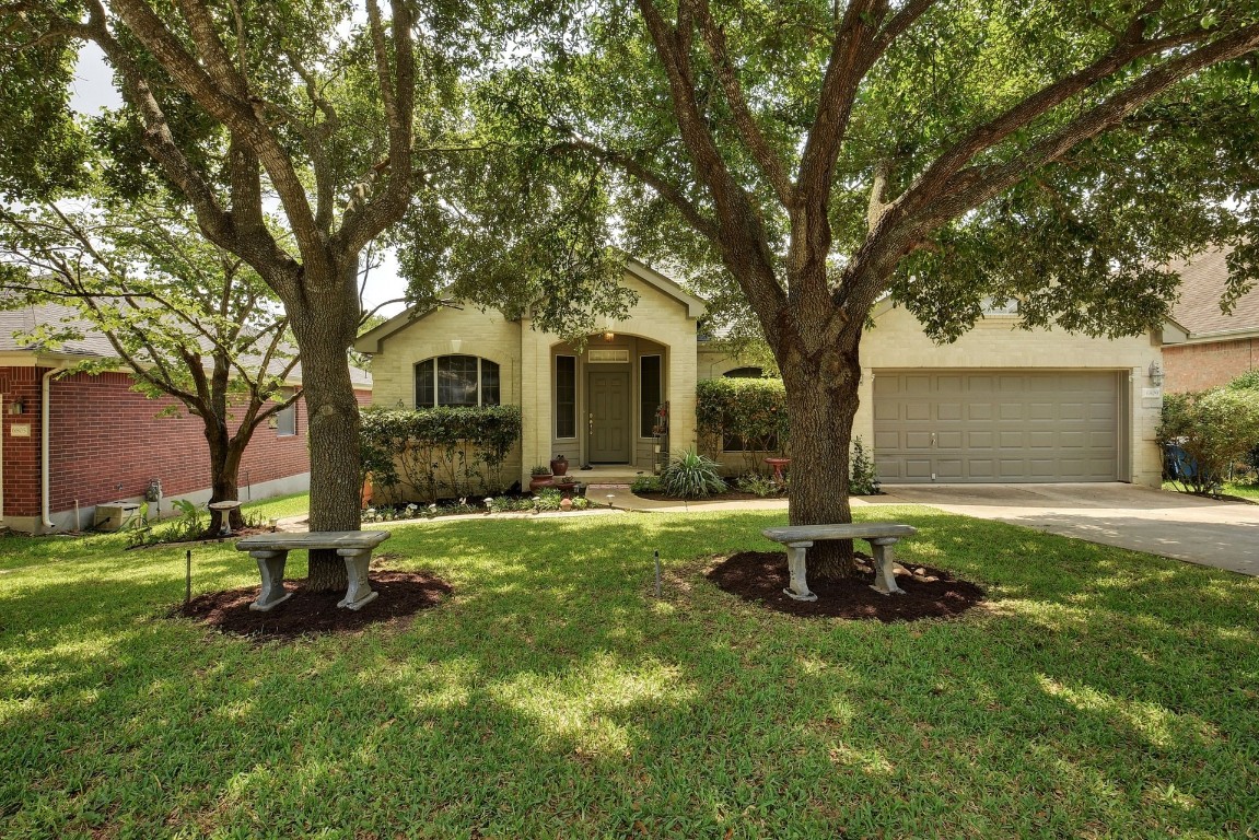6809 Beatty Drive Austin, TX 78749 - Photo 1 of 1 a front view of a house with garden