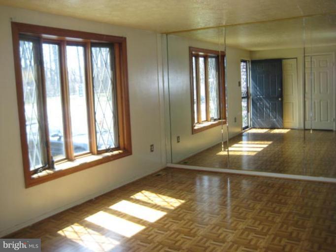 7928 Chipper Road Windsor Mill, MD 21244 - Photo 2 of 5 a view of empty room with window