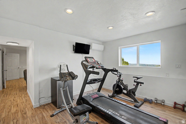 12645 East Cedar Ridge Drive Fairview, UT 84629 - Photo 27 of 34 Versatile flex space featuring wood-finish flooring, recessed lighting, and a large window offering expansive outdoor scenery
