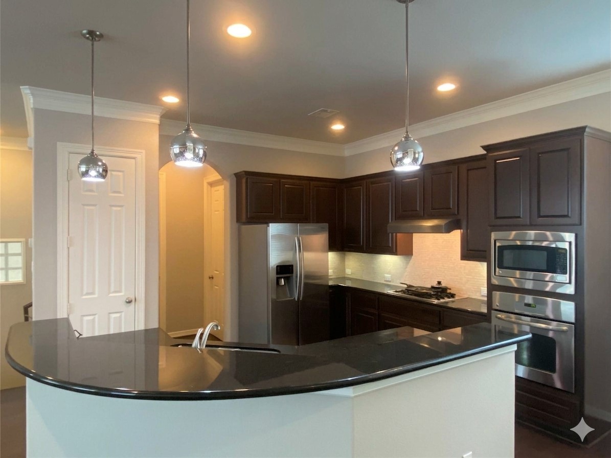 a kitchen with stainless steel appliances granite countertop a sink a stove and a refrigerator