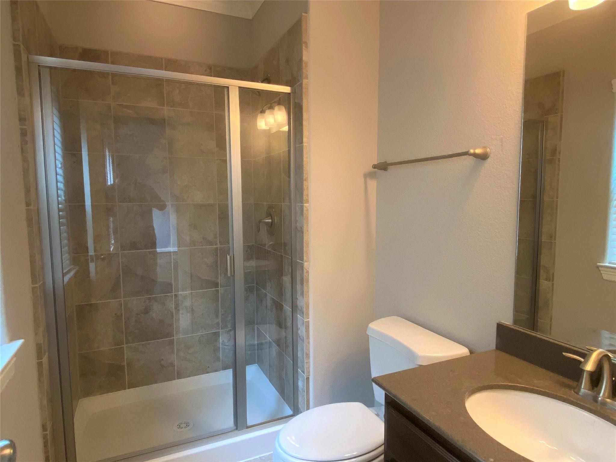 3002 Soutine Street Houston, TX 77021 - Photo 4 of 12 a bathroom with a sink toilet and shower
