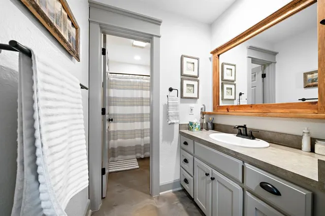 a white toilet sitting next to a shower