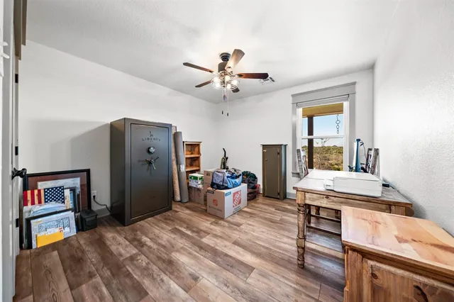 a view of a livingroom with furniture and wooden floor