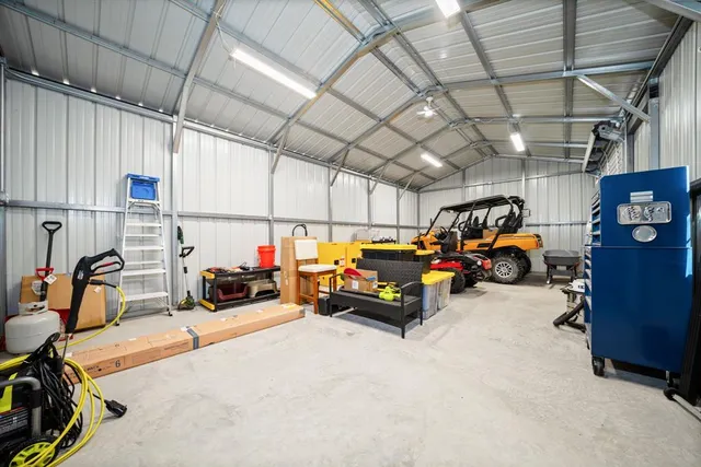 a view of parking garage with cars