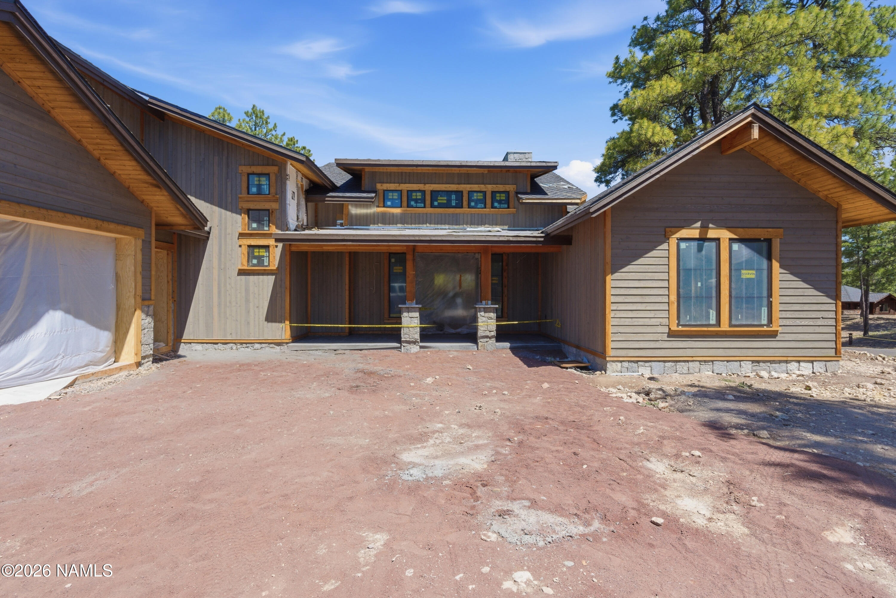 2380 East Del Rae Drive Flagstaff, AZ 86005 - Photo 20 of 26 a view of a house with a backyard and garage