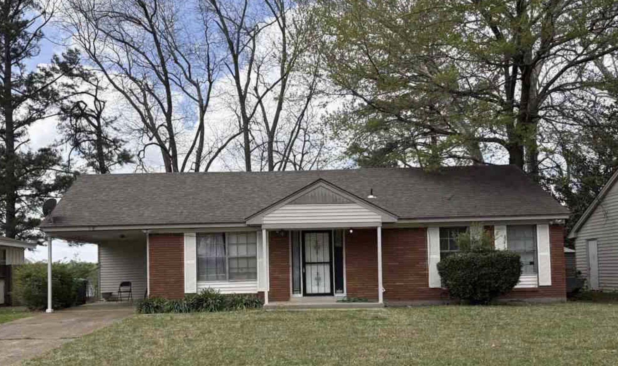 5181 Valdaz Road Memphis, TN 38109 - Photo 1 of 3 Red brick facade with white siding accents and a covered carport