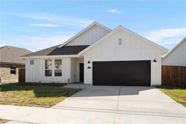 a front view of a house with garage