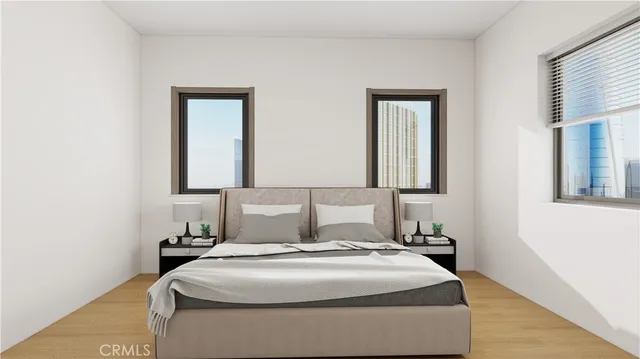 a bedroom with a bed and a night stand