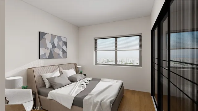 a bedroom with a bed and a window