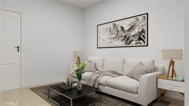 a living room with furniture and a potted plant