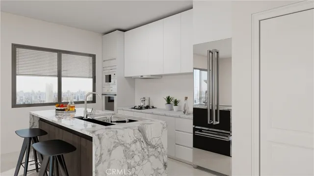 a kitchen with a sink cabinets and appliances
