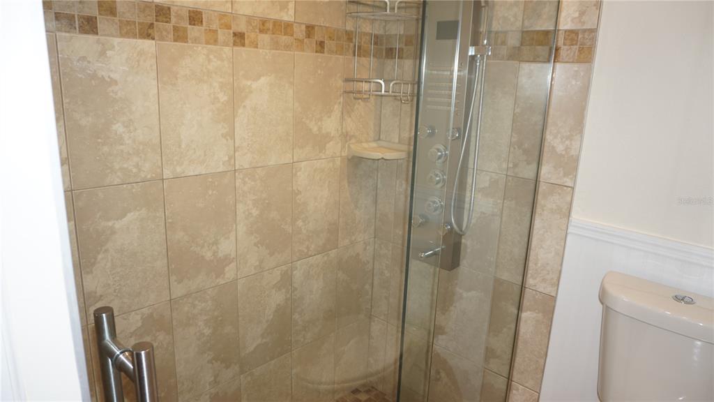 7602 Danube Drive, Unit 7602 Hudson, FL 34667 - Photo 12 of 31 a bathroom with a shower