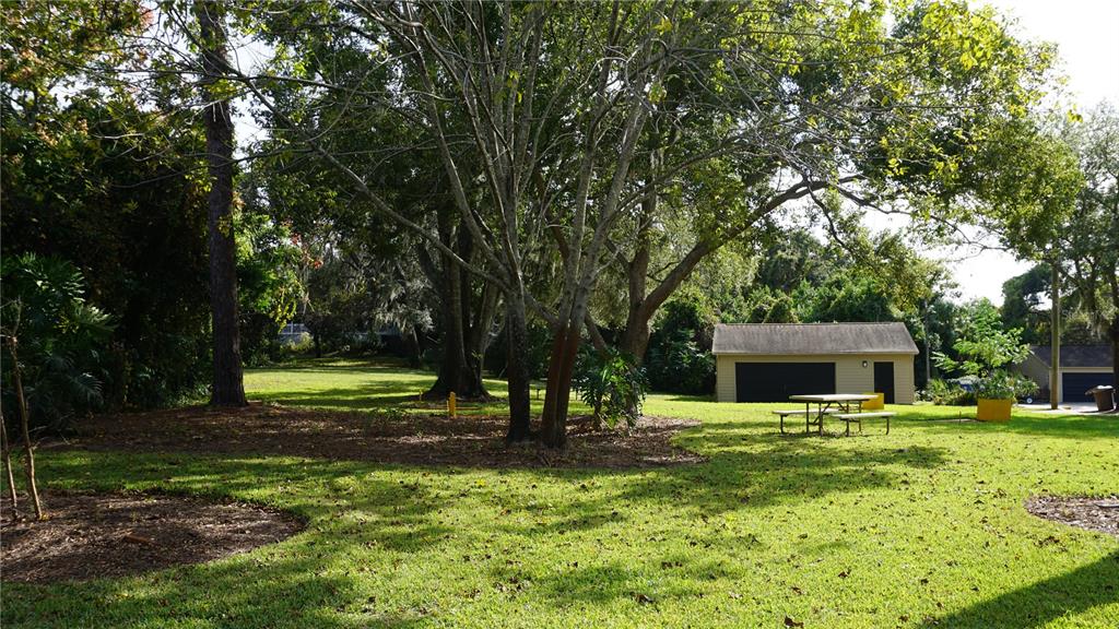 7602 Danube Drive, Unit 7602 Hudson, FL 34667 - Photo 26 of 31 a view of a house with a backyard