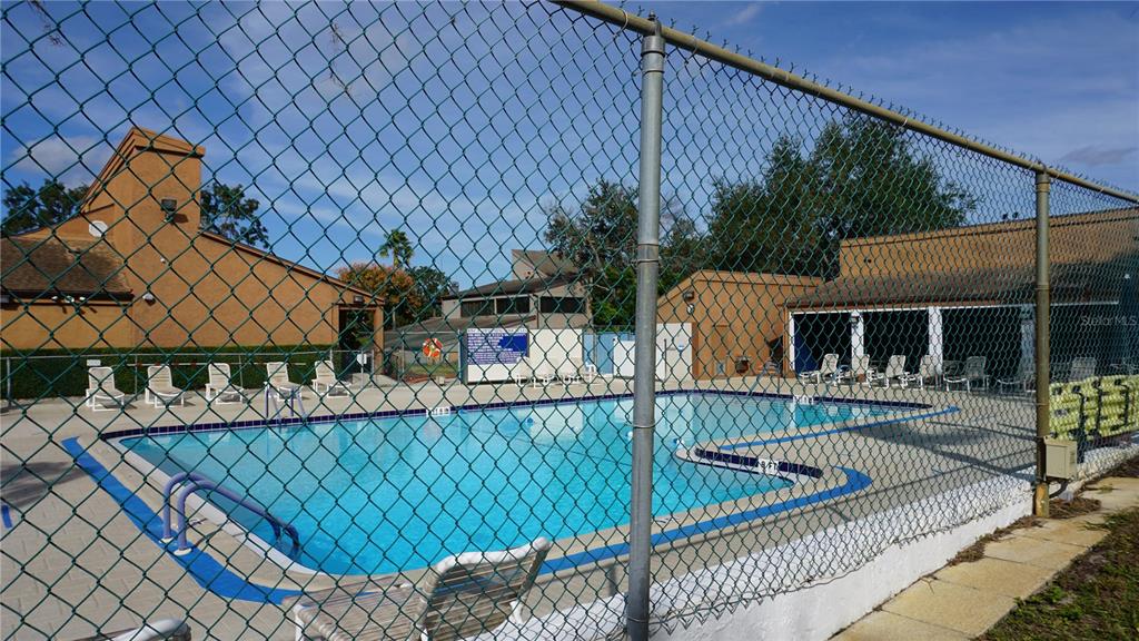 7602 Danube Drive, Unit 7602 Hudson, FL 34667 - Photo 27 of 31 a view of house with a chairs in balcony