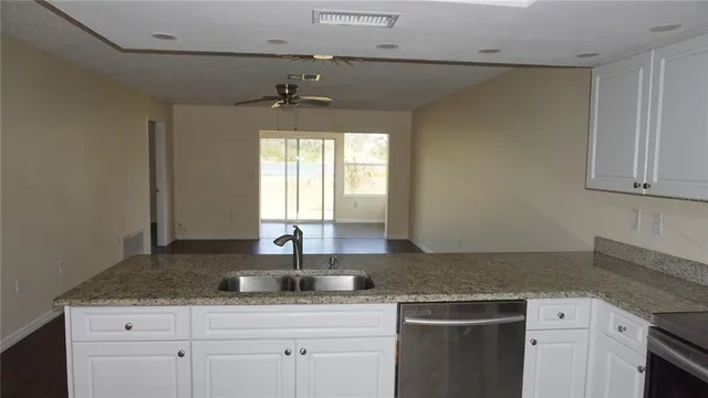 a kitchen with a sink and a window