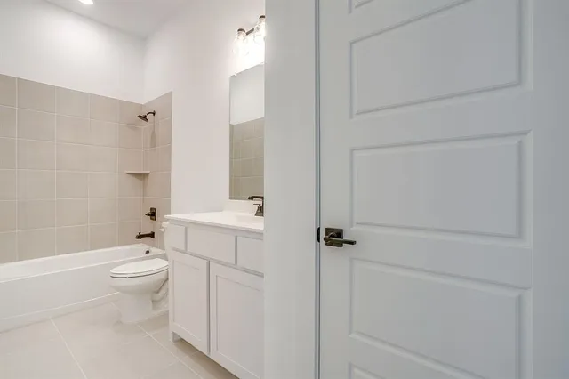 a bathroom with a toilet a sink and bath tub