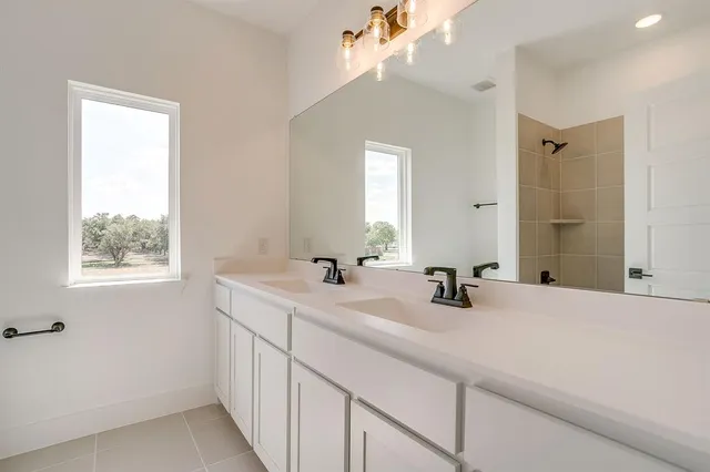 a bathroom with a sink a vanity and a mirror