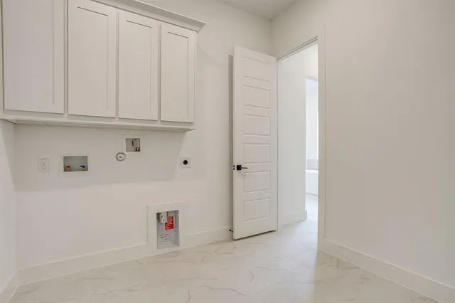 a view of room with an empty refrigerator