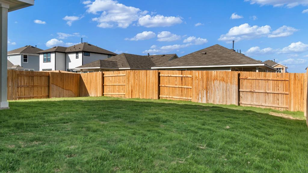 208 Stein Road Georgetown, TX 78626 - Photo 30 of 30 Fenced backyard with a residential view