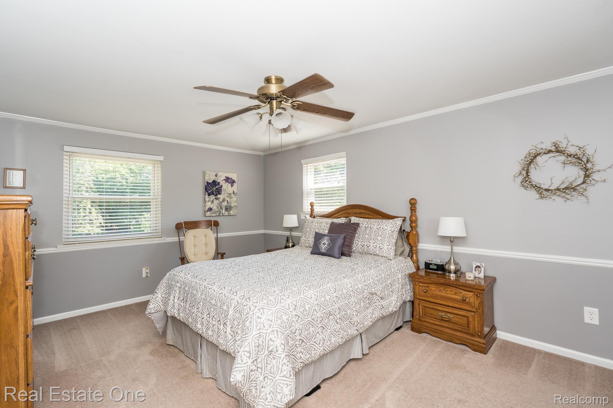 3028 Baypoint Drive Rochester, MI 48309 - Photo 20 of 40 LARGE MASTER BEDROOM WITH CHAIR RAIL AND CROWN MOLDINGS